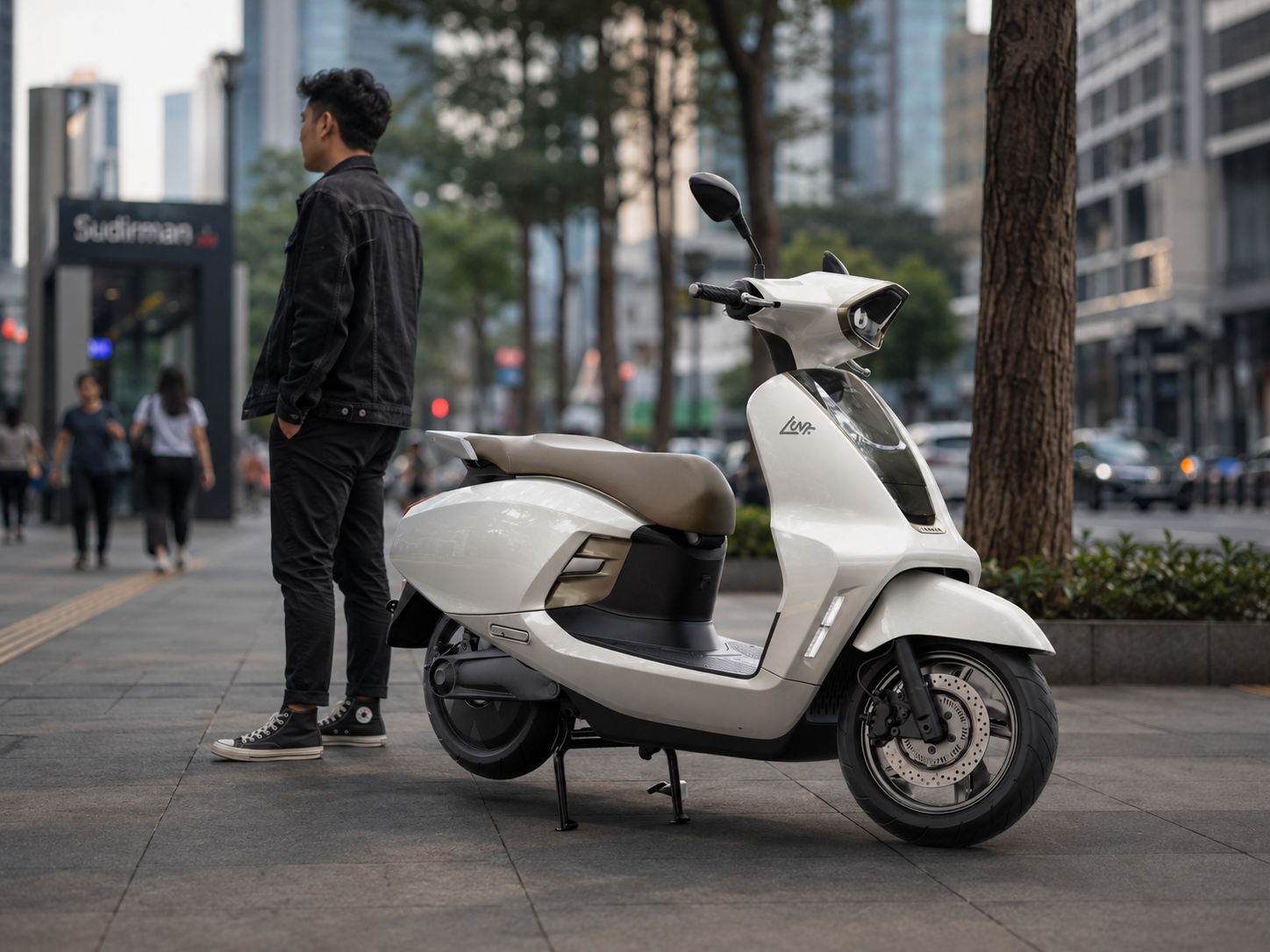 Luna electric scooter on a Jakarta street with rider